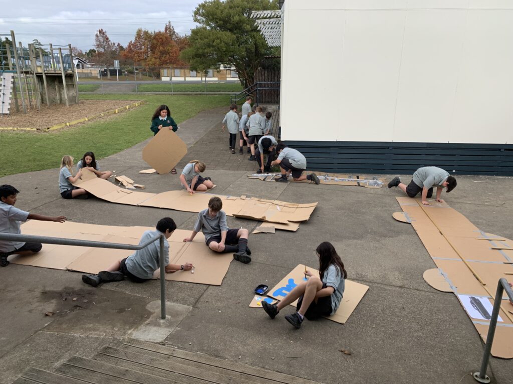 Students working on production material